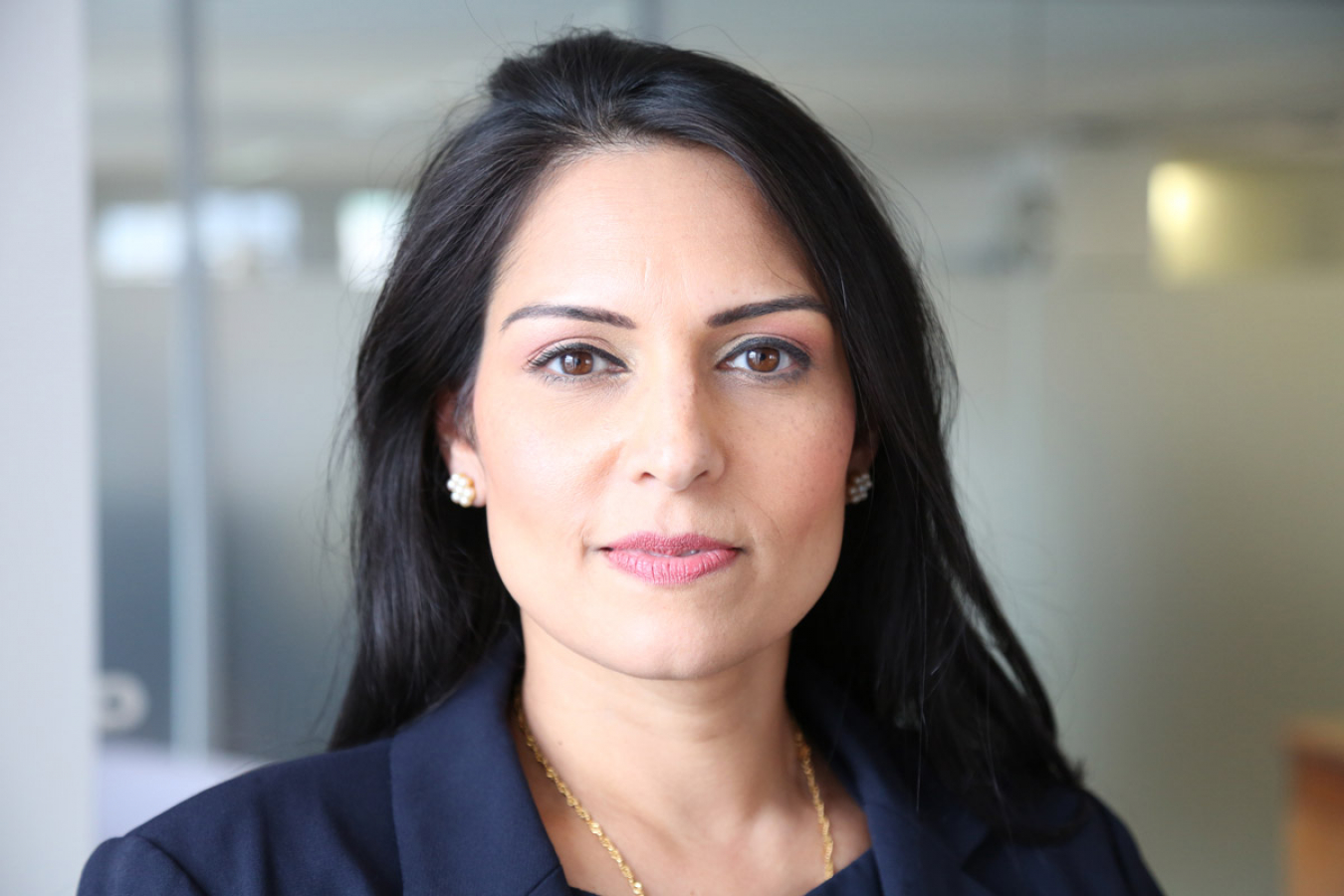UK immigration watchdog issues scathing report on asylum seeker accommodation and calls grow for Priti Patel to ‘consider her position’. Priti Patel